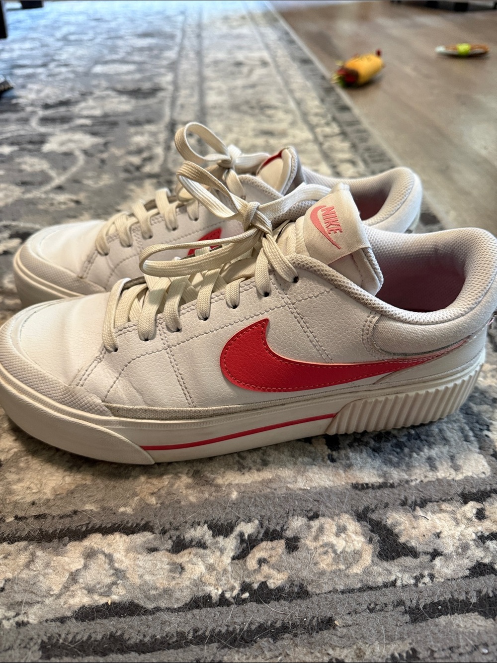 Woman’s Nike White Platform Sneakers with Pink Accents